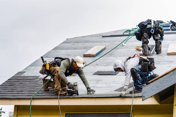Professional Roofing technician working in West End, NC